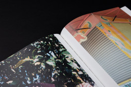 close-up photography of a photobook lying on a black background