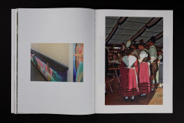 spreads of a photobook lying on a black background