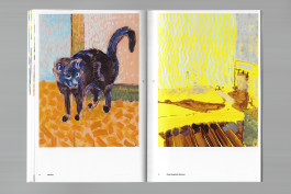 Spreads of an art publication on a grey background