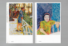 Spreads of an art publication on a grey background