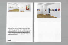 Spreads of an art publication on a grey background