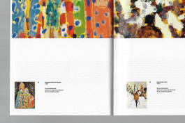 Spreads of an art publication on a grey background