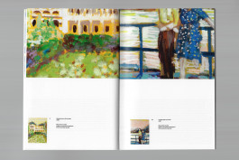 Spreads of an art publication on a grey background