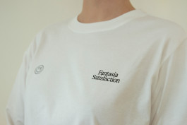 photography of a woman wearing a white shirt with a black print on it 