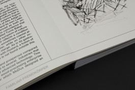 spread of an architecture portfolio book on a black background