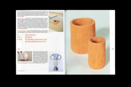 spreads of a publication lying on a black background