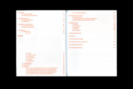 spreads of a publication lying on a black background