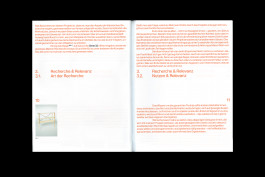 spreads of a publication lying on a black background