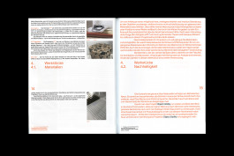 spreads of a publication lying on a black background