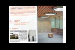 spreads of a publication lying on a black background 