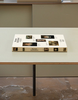 Cover of an art book lying on a table. 