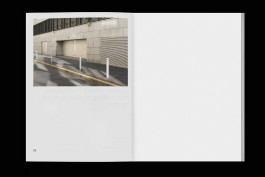 spreads of a photo zine lying on a black background