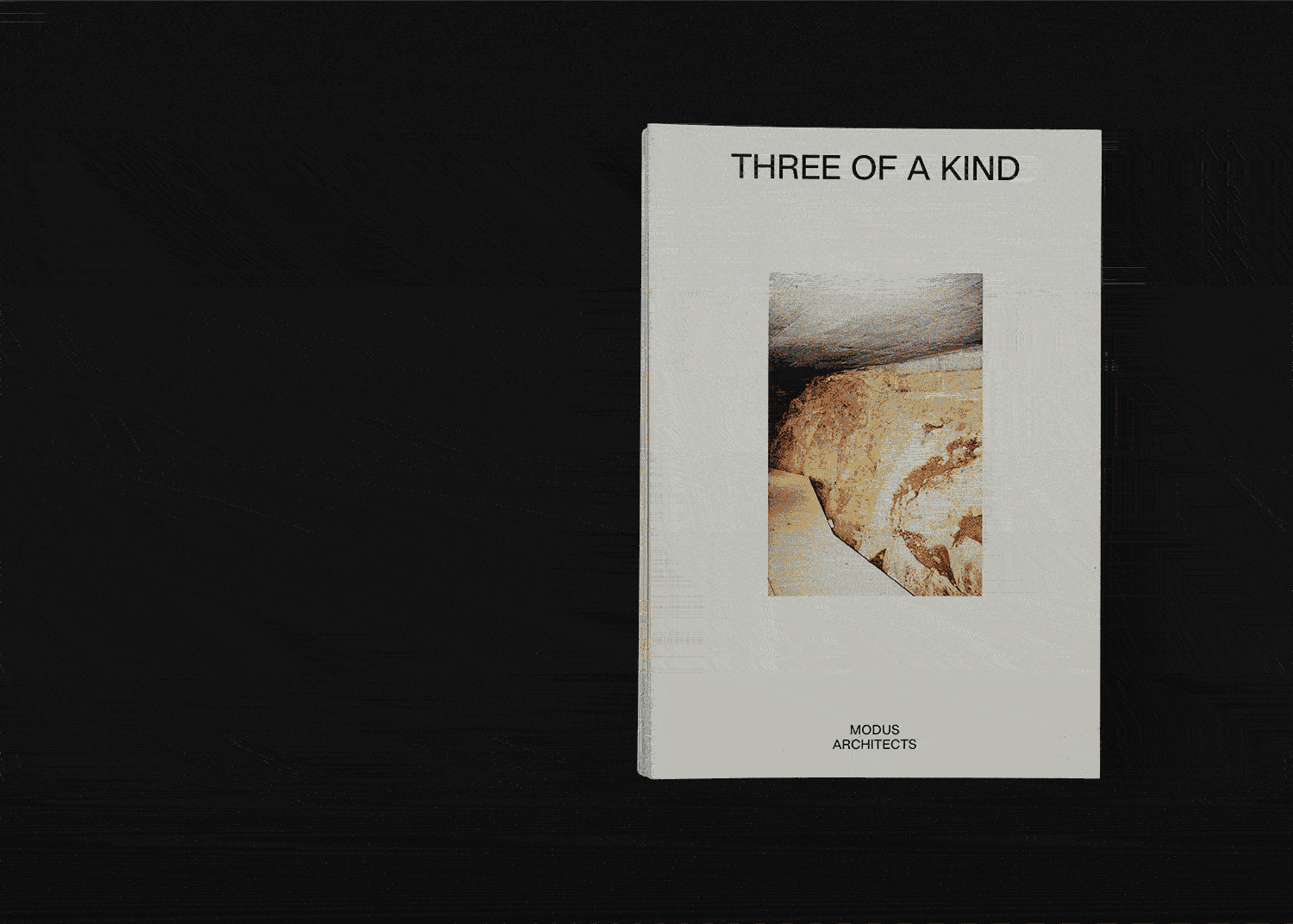 spread of an architecture portfolio book on a black background