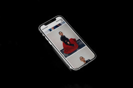 photography of a iphone on a black background showing the website of photographer felix gundlach